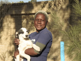 Mary Kwembu with dog Good Morning Angels