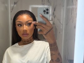 Megan Thee Stallion holding mobile phone