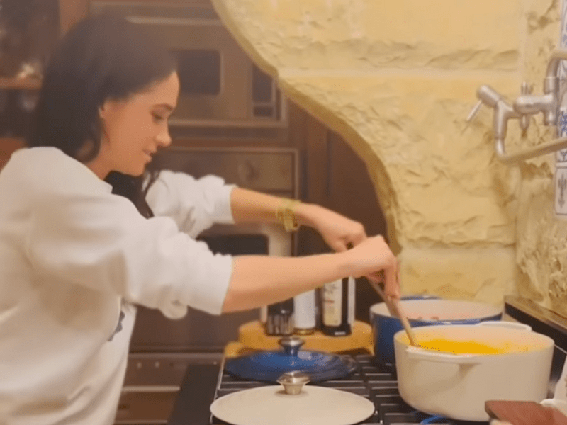 Meghan Markle stirring two pots at once