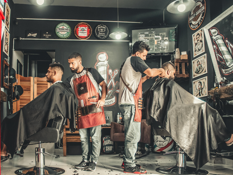 Men having their hair cut at a barber salon