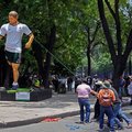Protestors pull down a giant sculpture alluding to the FIFA 2026 World Cup during a demonstration by the CNTE in Mexico City