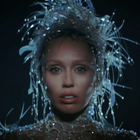 Miley Cyrus wearing an avant garde headpiece decorated with crystals