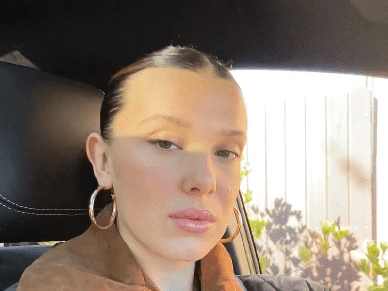 Millie Bobby Brown sitting in a car