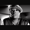 Missy Elliot wearing a stylish hair and hoop earrings