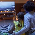Mom and child watching a movie