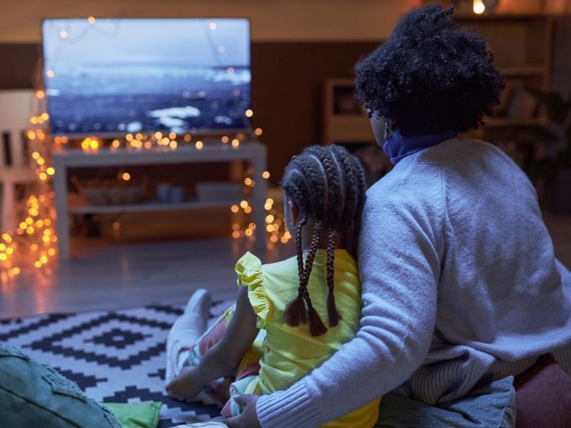Mom and child watching a movie