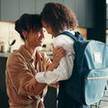Mom and daughter hugging before school