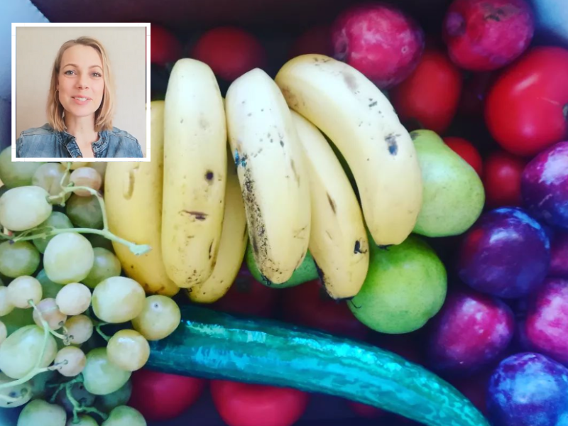 Mom with a box full of fruits and veggies