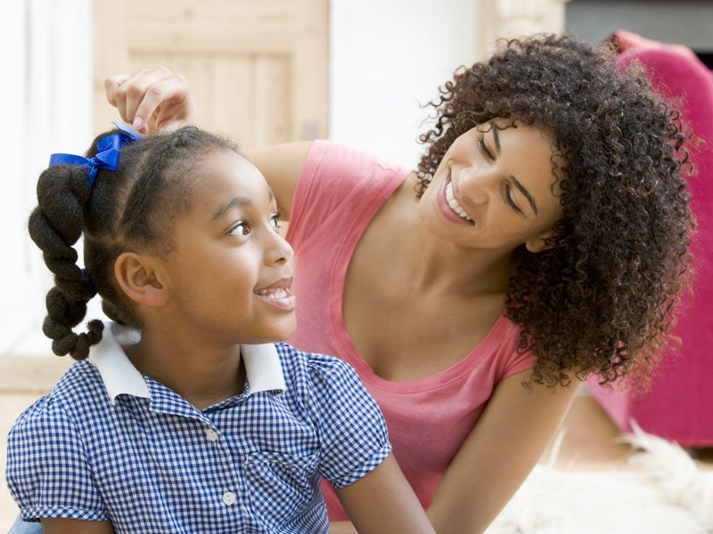 Mother and daughter in school uniform