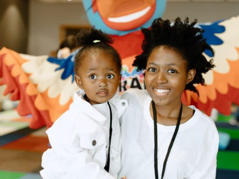 Mother and daughter smiling