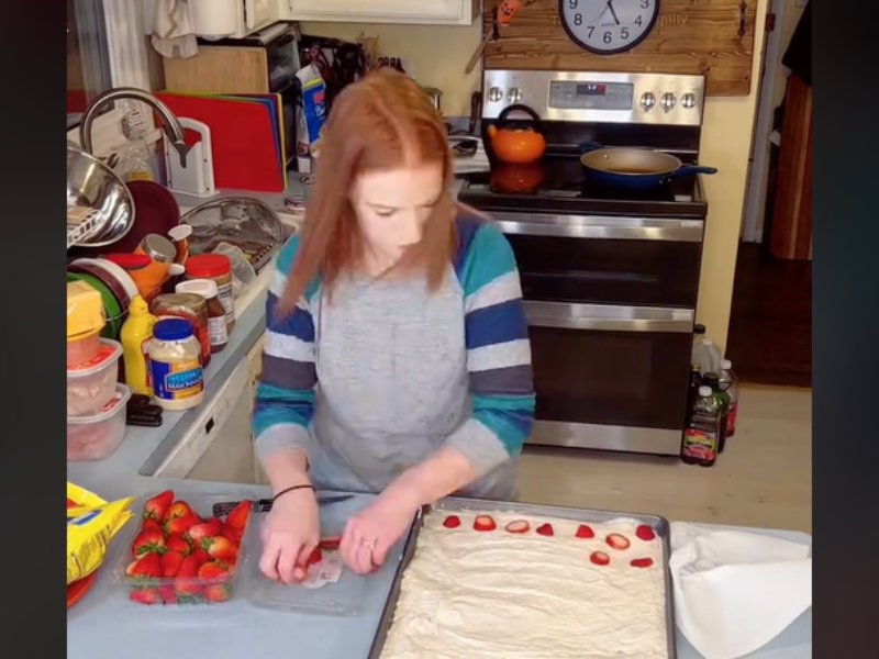 Mother preparing sheet pan pancakes