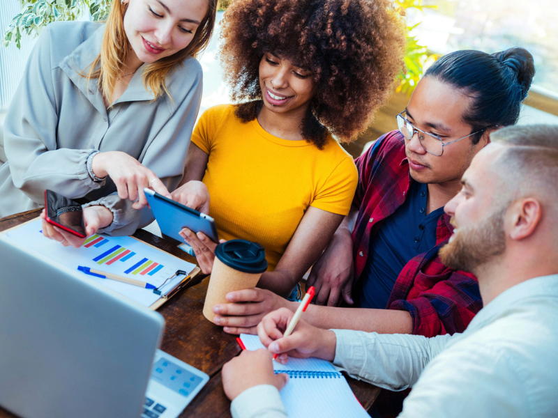 Multiracial diverse coworkers using tablet device