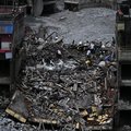 People salvage usable materials from their houses in Nepal