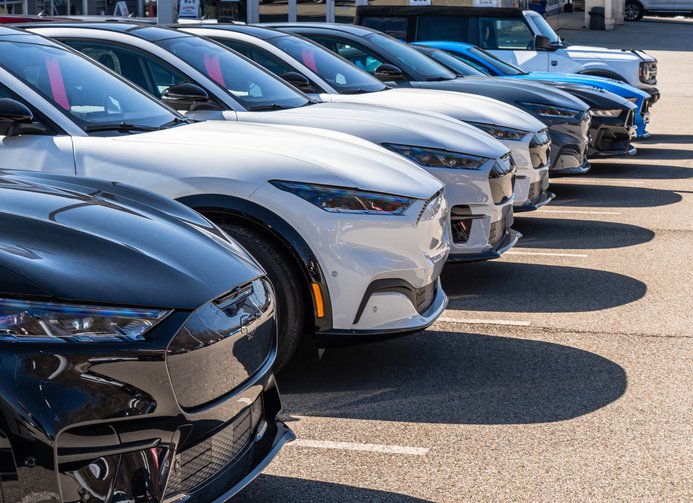 New Ford vehicles lined up for sale at a dealership