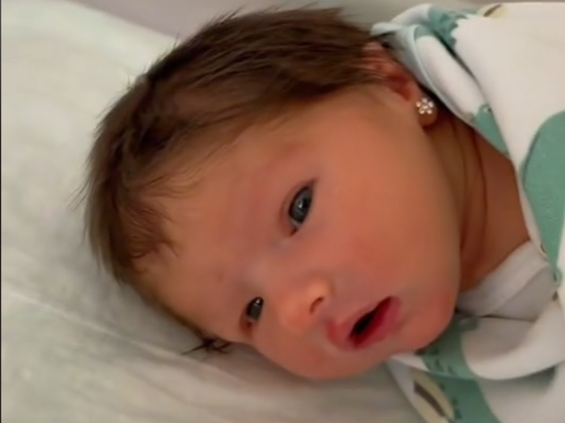 Newborn with pierced ears