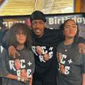 Nick Cannon poses with his twins Roc and Roe