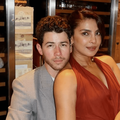 Priyanka Chopra and Nick Jonas pose in a wine cellar