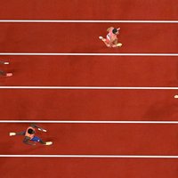 US athlete Noah Lyles crosses the finish line