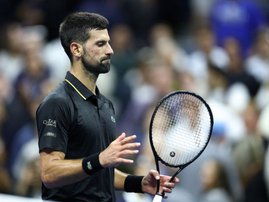 Serbia's Novak Djokovic gestures after winning the men's singles quarterfinal tennis match against USA's Taylor Fritz