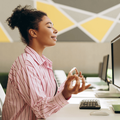 Office worker meditation at her desk for stress