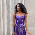 Olivia Dean wearing a purple sequin dress