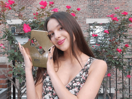 Olivia Rodrigo holds #1 album trophy
