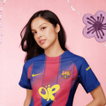 Olivia Rodrigo wearing a Barcelona Nike jersey