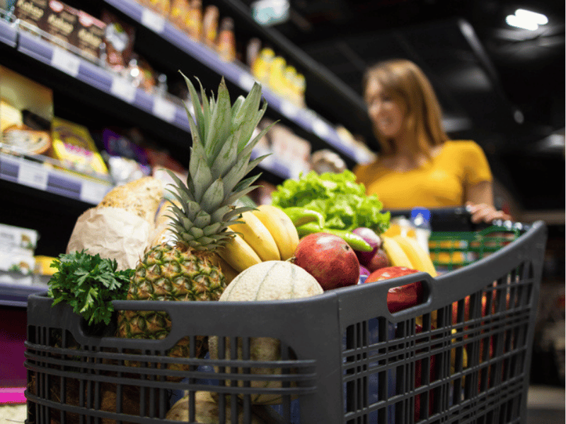 PERSON SHOPPING WITH TROLLEY