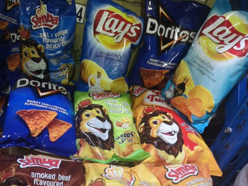 Packets of crisps lying next to one another