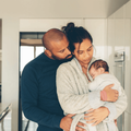 Parents spending time with newborn son in morning