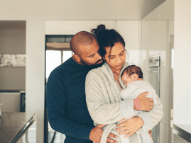 Parents spending time with newborn son in morning