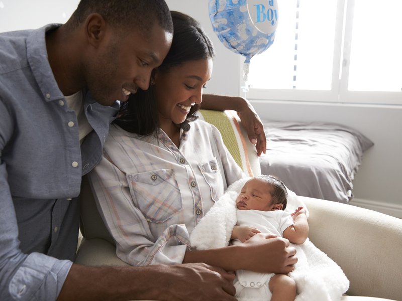 Parents holding their newborn baby