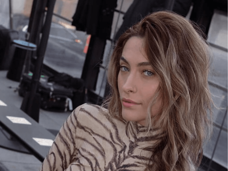 Paris Jackson wearing an animal print dress