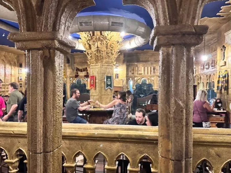 People seated at Harry Potter themed restaurant in Italy