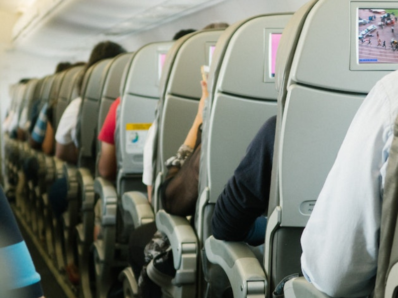 People sitting on plane chairs