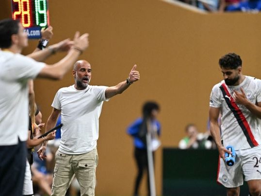 Manchester City head coach Pep Guardiola gestures next to Manchester City defender Josko Gvardiol during the FIFA Club World Cup 2025 Group G football match