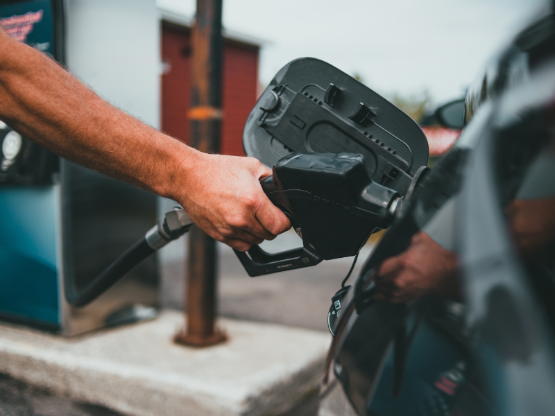 Person filling petrol in car