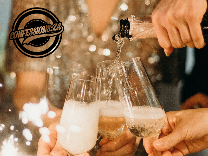 Person pouring champagne in champagne flutes at a party