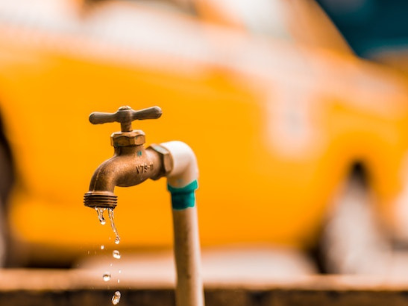 Photo of plastic faucet leaking water