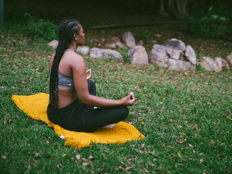 Photo of woman meditating in nature