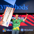 Pieter Pienaar holding up his winning cheque at the Microsoft Excel Collegiate Challenge