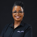 Pindiwe Filtane poses using her company shirt