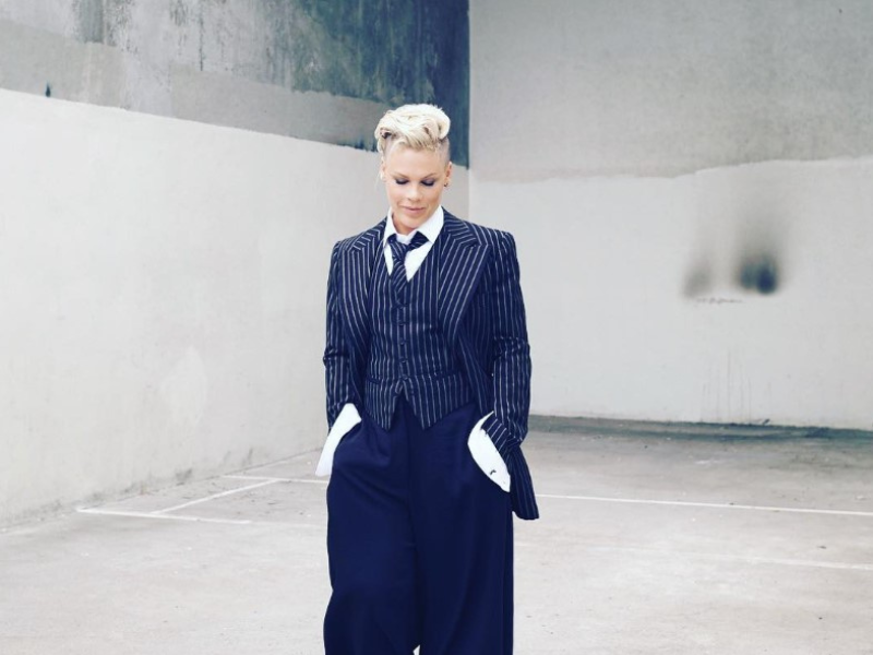 Pink wearing a black and white suit