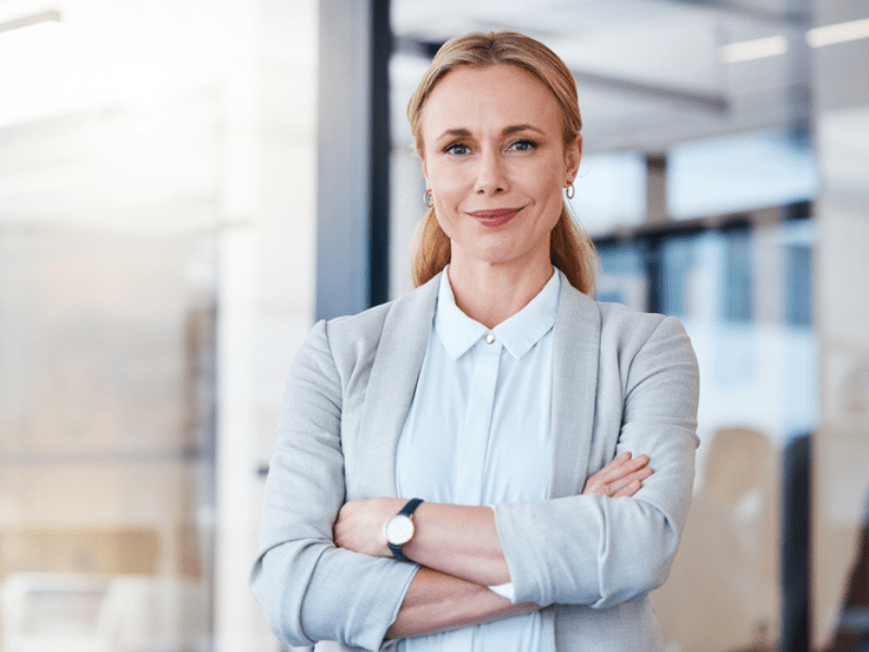 Corporate woman posing in an office