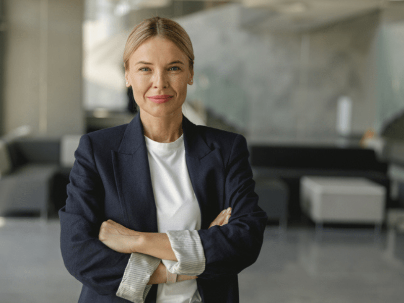 Portrait of confident businesswoman with crossed hands