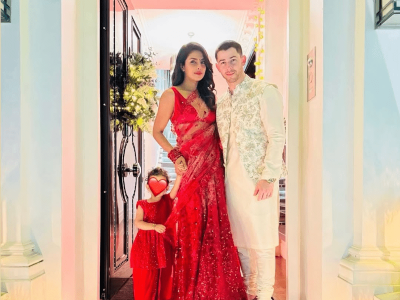 Priyanka Chopra and Nick Jonas wearing traditional Indian attire