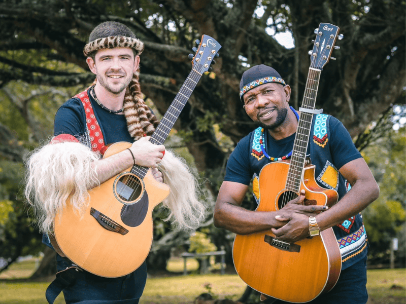 Qadasi and Maqhinga pose with their musical instruments