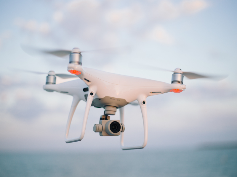 Quadcopter or drone flying over the sky