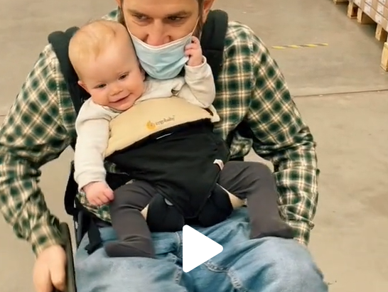 Quadriplegic father picks up his baby girl