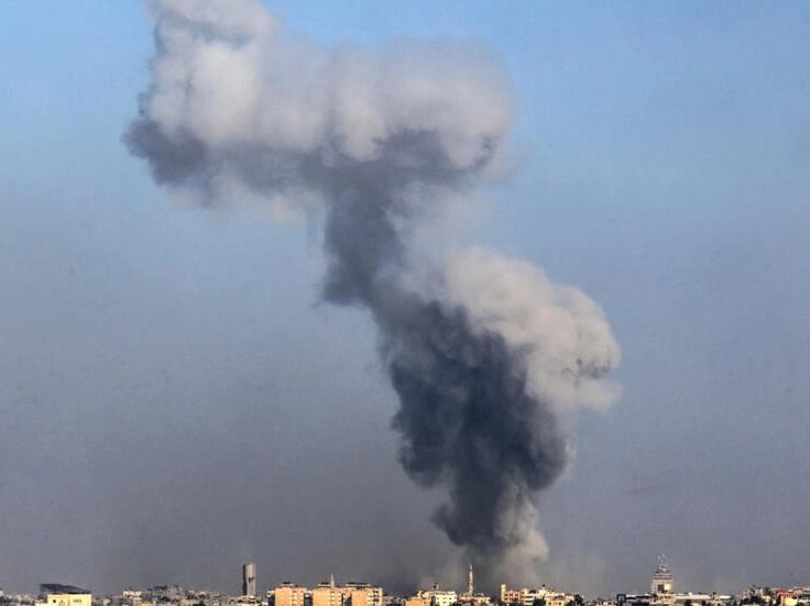 A picture taken from Rafah on January 6, 2024 shows smoke billowing over Khan Yunis in the southern Gaza Strip
